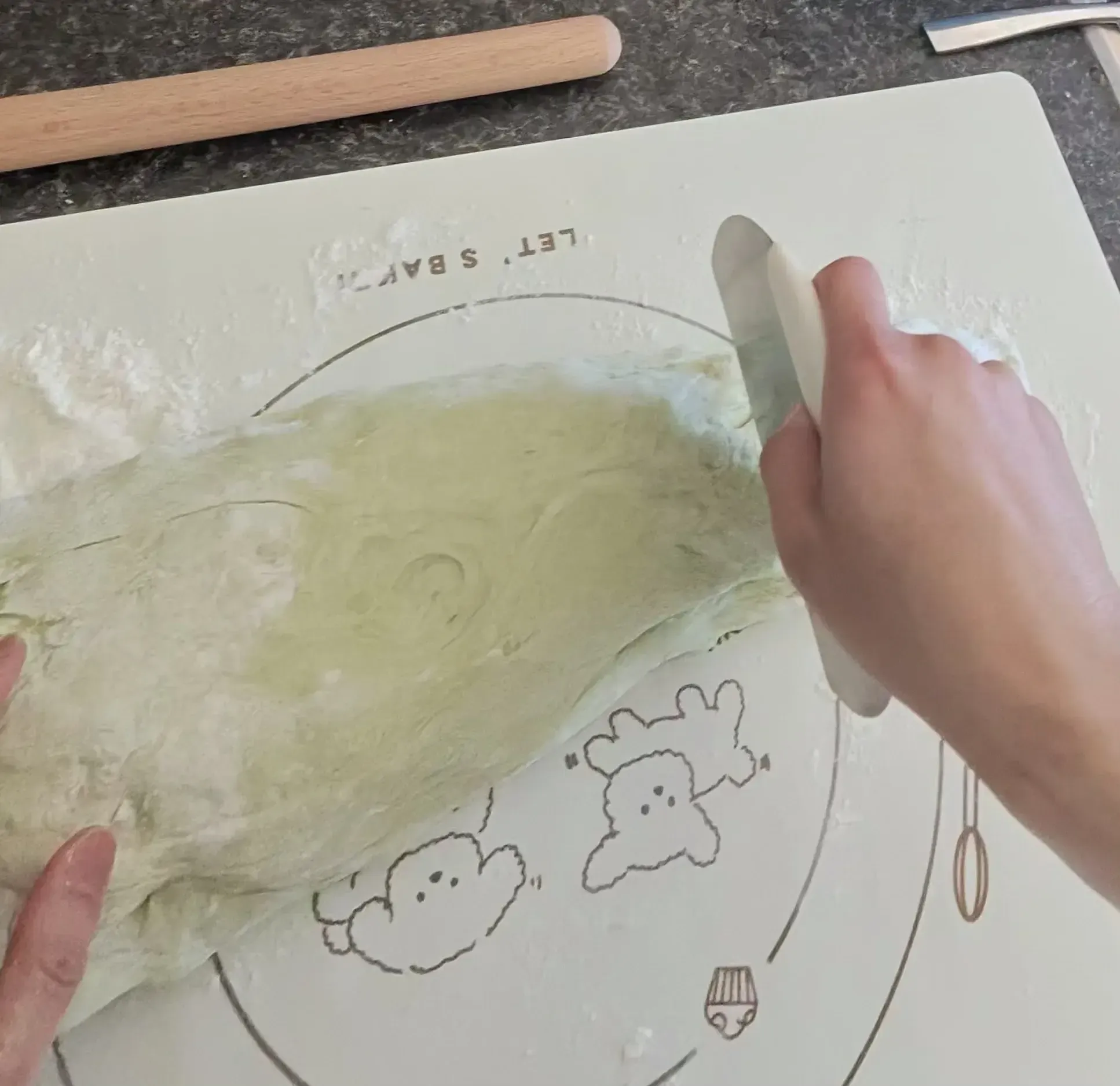 Cutting dough log with bench scraper